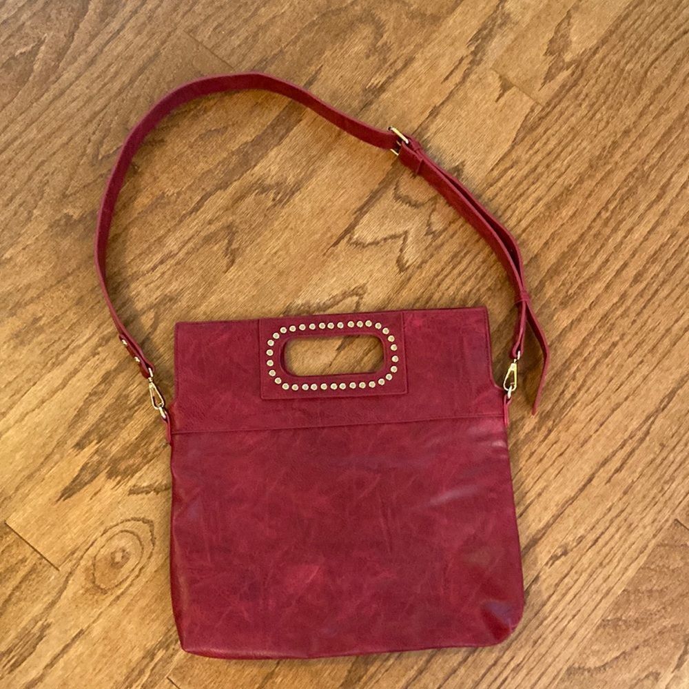 Ah-dorned dark red back with gold accents shoulder or cross body